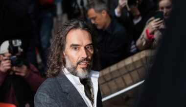 Russell Brand arrives at a London court for his trial on rape and sexual assault charges