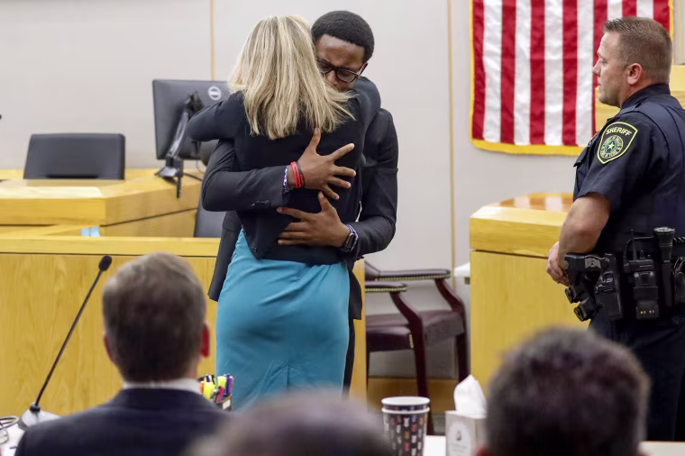 Botham Jean's younger brother Brandt Jean hugs Amber Guyger.