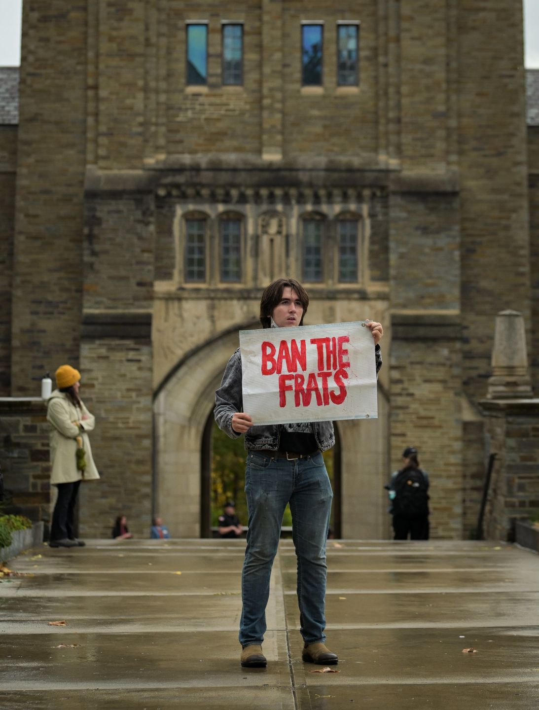 Cornell University student Hudson Athas protests outside the Myron Taylor Hall.