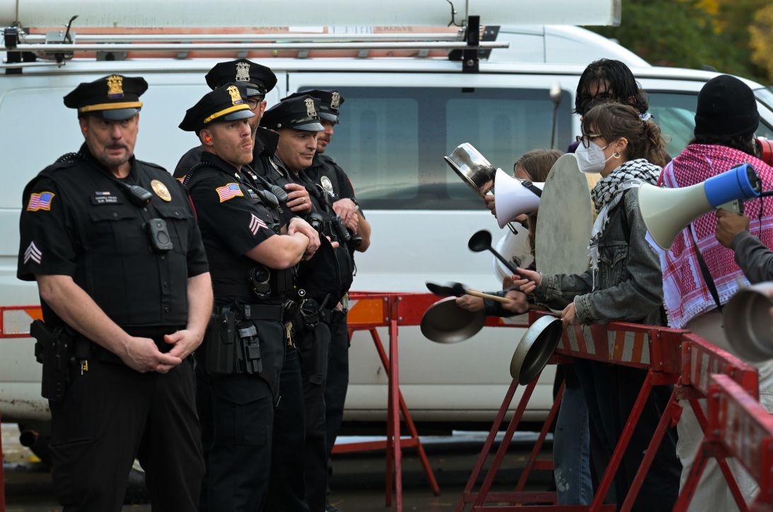 Protesters confront Cornell University police officers during a campus protest on Friday.