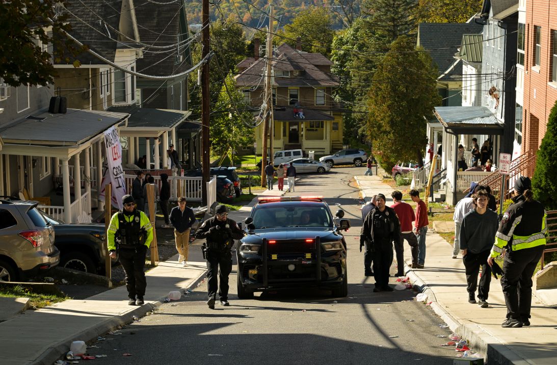 Ithaca police clear a Collegtown street Cornell partygoers on Saturday.