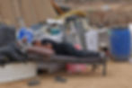 A man lies on a bed next to other items that were salvaged from the demolition of buildings of the Abu Wadi Bedouin, for lack of construction permits, in the village of al-Dhahiyah near Rahat in Israel's southern district on October 12, 2026. (AFP)