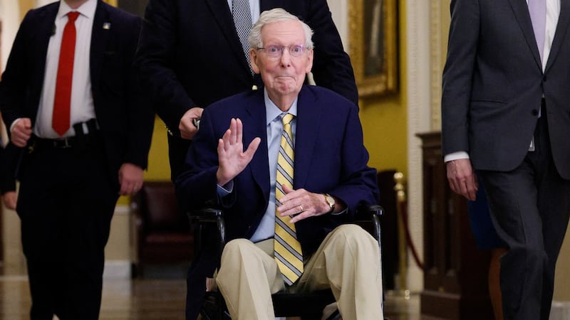 Senator Mitch McConnell waves at reporters outside the Senate Chamber after he returned to Capitol Hill  on September 14, 2026 for the first time in more than three months.