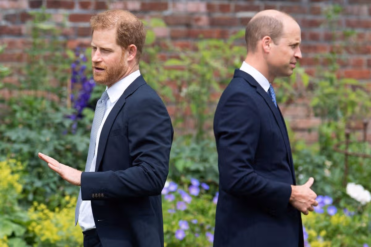 TOPSHOT - Britain's Prince Harry, Duke of Sussex (L) and Britain's Prince William, Duke of Cambridge attend the unveiling of a statue of their mother, Princess Diana at The Sunken Garden in Kensington Palace, London on July 1, 2021, which would have been her 60th birthday. Princes William and Harry set aside their differences on Thursday to unveil a new statue of their mother, Princess Diana, on what would have been her 60th birthday. (Photo by Dominic Lipinski / POOL / AFP via Getty Images)