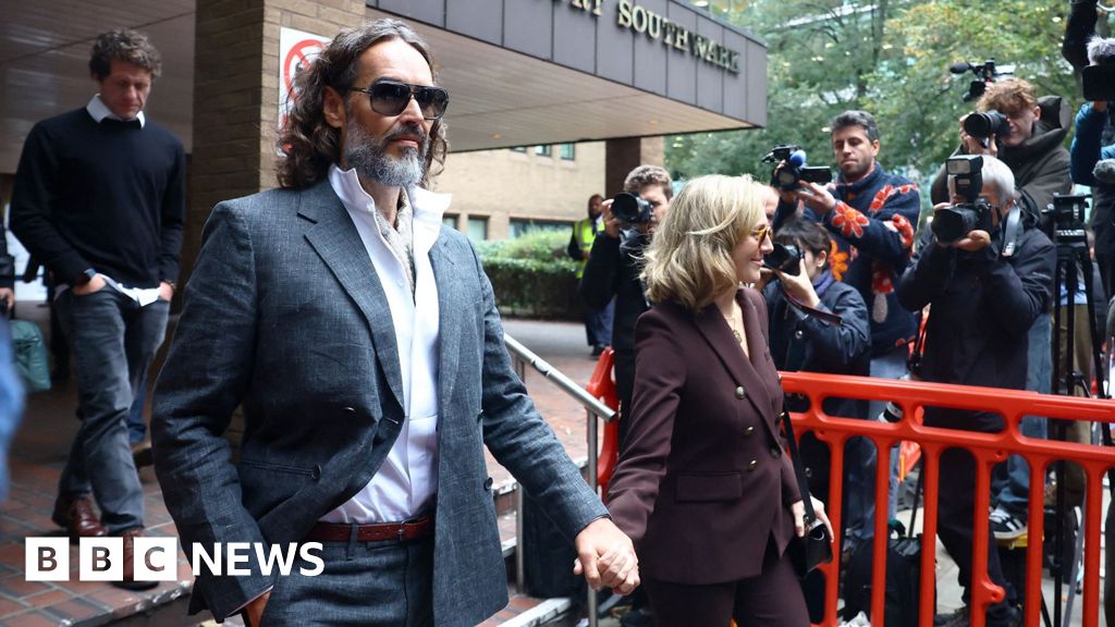 Russell Brand appears in court for start of rape trial - BBC