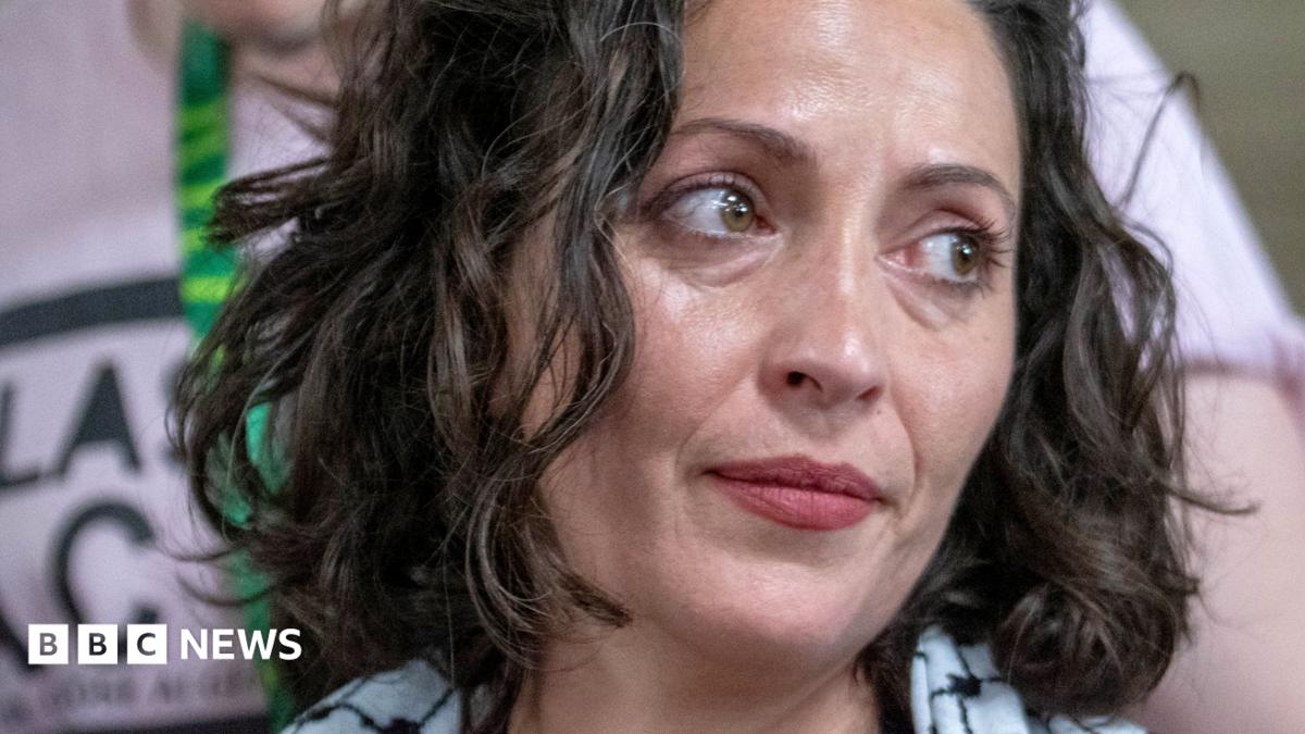 A close up image of Lubna Speitan looking to her side.