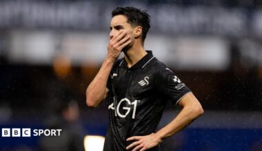 Stephen Eustaquio in all black looks dejected after Swansea's defeat at QPR