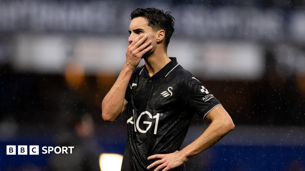 Stephen Eustaquio in all black looks dejected after Swansea's defeat at QPR