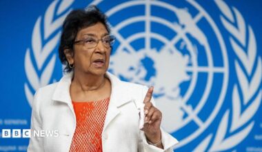 Navi Pillay, wearing an orange top and white jacket, points during press conference in Geneva on 16 September 2025.