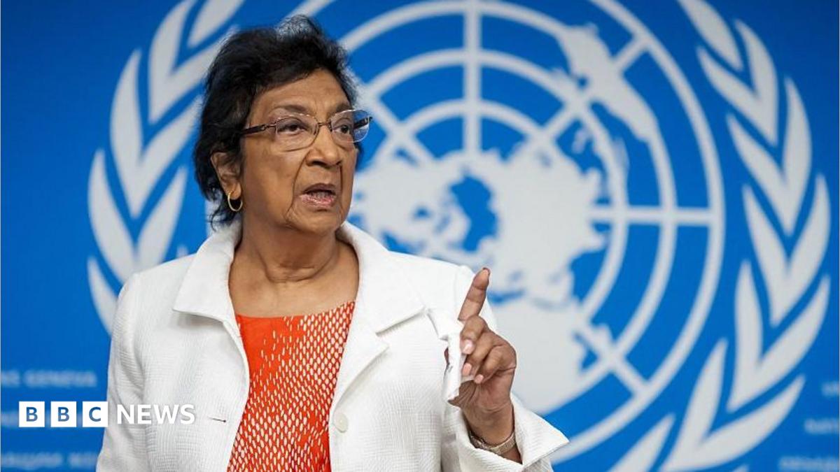 Navi Pillay, wearing an orange top and white jacket, points during press conference in Geneva on 16 September 2025.