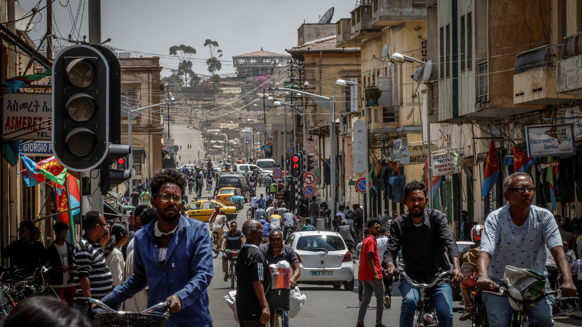 People walk and ride bicycles on a busy street in downtown Asmara, Eritrea, June 19, 2026. Eritrea has long been isolated by the West, which views the East African country as among the most repressive in the world, while the government in Asmara has itself pursued a policy of political and economic seclusion. Despite its small population, Eritrea has gained new geopolitical importance this year, during the Iran war, because of its 1,000-km Red Sea coastline along a key shipping route between the Mediterranean and Asia. As conflict disrupted traffic through the Strait of Hormuz and attacks by Iran-backed Houthi militants threatened vessels near Yemen, Eritrean waters emerged as potentially one of the safest corridors for maritime trade. REUTERS/Monicah Mwangi People walk and ride bicycles on a busy street in downtown Asmara, Eritrea, June 19, 2026. Eritrea has long been isolated by the West, which views the East African country as among the most repressive in the world, while the government in Asmara has itself pursued a policy of political and economic seclusion. Despite its small population, Eritrea has gained new geopolitical importance this year, during the Iran war, because of its 1,000-km Red Sea coastline along a key shipping route between the Mediterranean and Asia. As conflict disrupted traffic through the Strait of Hormuz and attacks by Iran-backed Houthi militants threatened vessels near Yemen, Eritrean waters emerged as potentially one of the safest corridors for maritime trade. REUTERS/Monicah Mwangi