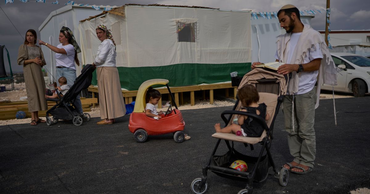 Photos show Israeli settlers celebrating settlement expansion in the occupied West Bank :: WRAL.com