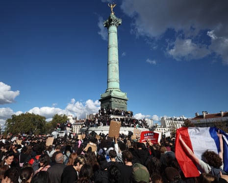 Protesters gather for a student demonstration at Place de la Bastille with a view of the Colonne de Juillet monument in Paris.