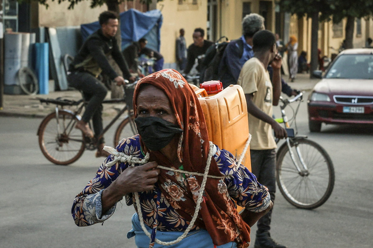 A woman carries a jerrycan in downtown Asmara, Eritrea, June 17, 2026. Eritrea has long been isolated by the West, which views the East African country as among the most repressive in the world, while the government in Asmara has itself pursued a policy of political and economic seclusion. Despite its small population, Eritrea has gained new geopolitical importance this year, during the Iran war, because of its 1,000-km Red Sea coastline along a key shipping route between the Mediterranean and Asia. As conflict disrupted traffic through the Strait of Hormuz and attacks by Iran-backed Houthi militants threatened vessels near Yemen, Eritrean waters emerged as potentially one of the safest corridors for maritime trade. REUTERS/Monicah Mwangi