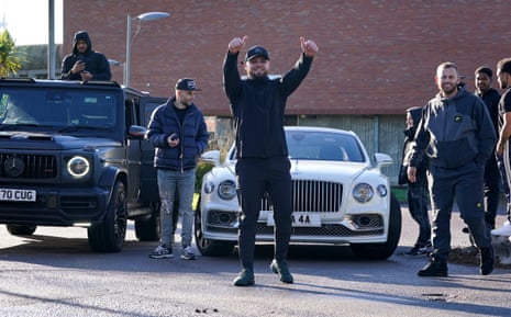Daniel Dowling-Brooks stood in front of a white Bentley with his thumbs up to the cameras.