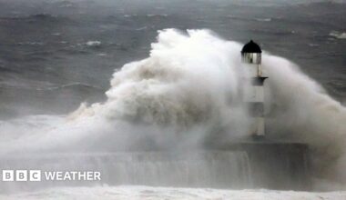 Large waves hitting a lighthouse during a storm
