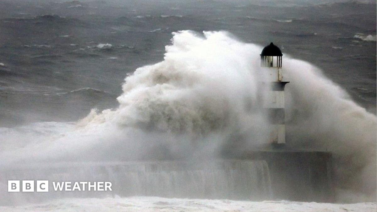 Large waves hitting a lighthouse during a storm