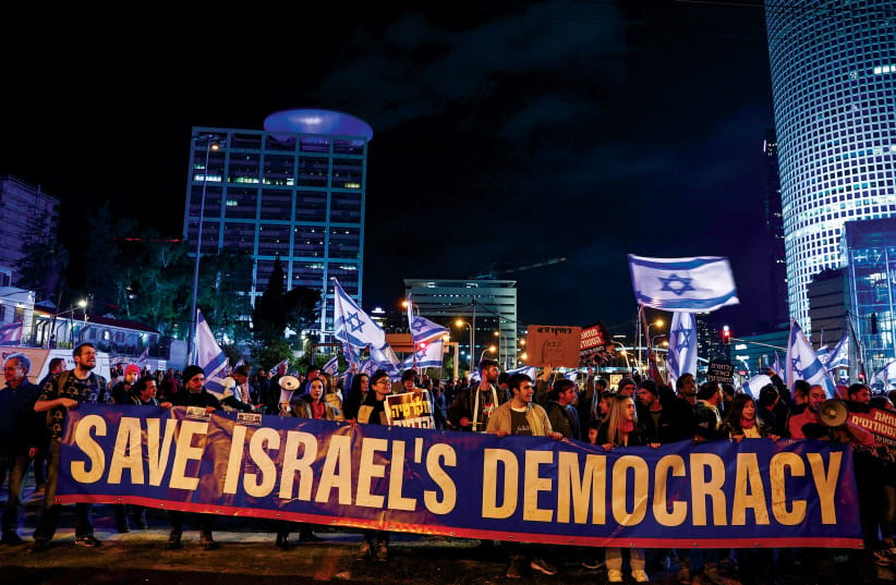 Israelis protest against the government’s proposed judicial reforms in Tel Aviv on February 4, 2023.