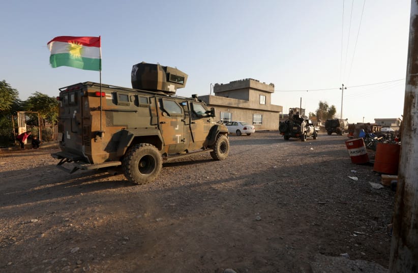 Iraqi forces and Kurdish Peshmerga fighters take part in an intensive security deployment after Islamic State militants took it over the previous day in Luhaiban village in Kirkuk, Iraq December 6,2021.