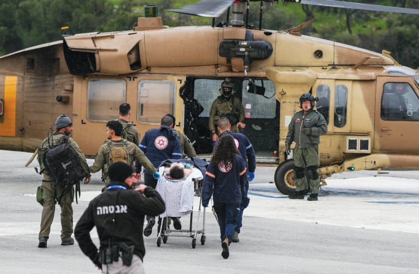 A MILITARY helicopter evacuates the wounded from Ziv Medical Center, injured by a Hezbollah missile fired earlier that day, to a Safed IDF base, Feb. 14.