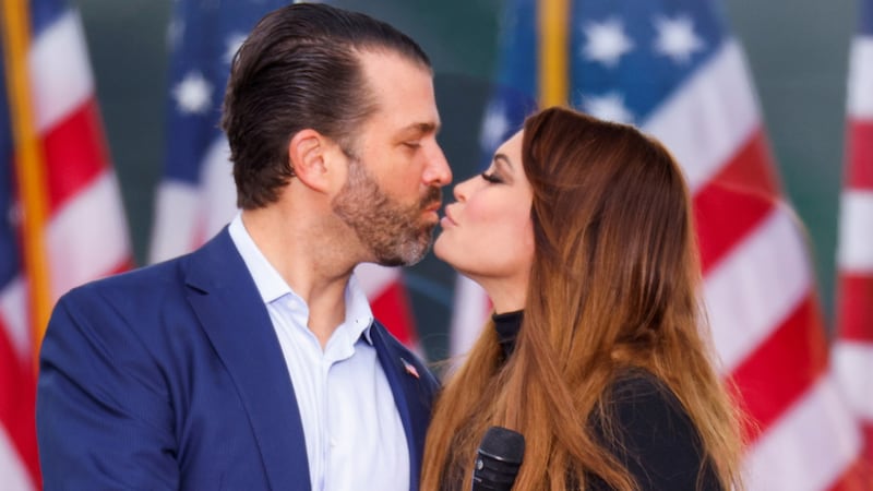 U.S. President Donald Trump's son Donald Trump Jr. and his girlfriend Kimberly Guilfoyle kiss as supporters of U.S. President Donald Trump gather by the White House ahead of Trump's speech to contest the certification by the U.S. Congress of the results of the 2020 U.S. presidential election in Washington, U.S, January 6, 2021.