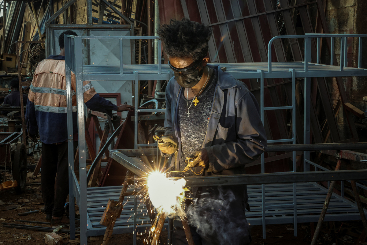 A worker welds at the Medeber Market, an open-air recycling and craft market in downtown Asmara, Eritrea, June 22, 2026. Eritrea has long been isolated by the West, which views the East African country as among the most repressive in the world, while the government in Asmara has itself pursued a policy of political and economic seclusion. Despite its small population, Eritrea has gained new geopolitical importance this year, during the Iran war, because of its 1,000-km Red Sea coastline along a key shipping route between the Mediterranean and Asia. As conflict disrupted traffic through the Strait of Hormuz and attacks by Iran-backed Houthi militants threatened vessels near Yemen, Eritrean waters emerged as potentially one of the safest corridors for maritime trade. REUTERS/Monicah Mwangi
