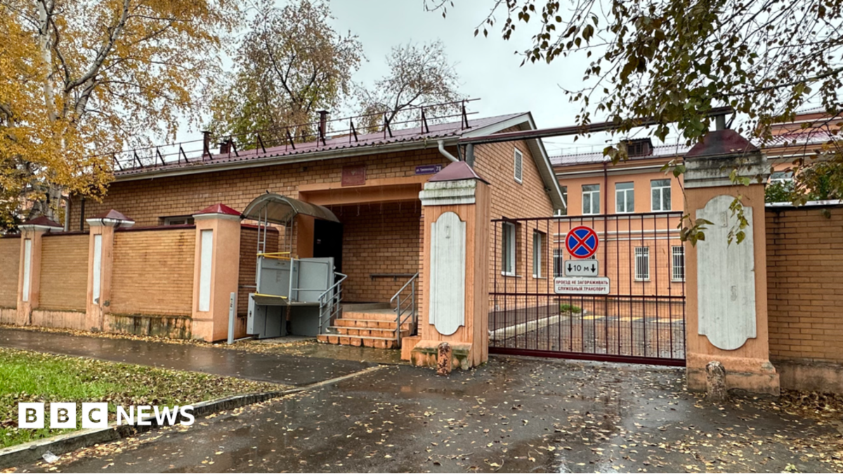 A view of the entrance to the grounds of the anti-plague institute in the Russian city of Irkutsk, with red-brick buildings visible behind a gate, 6 October 2026