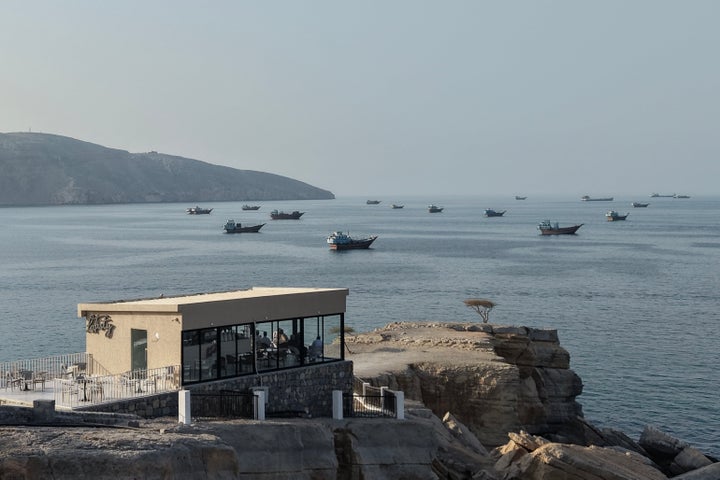 TOPSHOT - An aerial view shows ships anchored off the coast of Khasab in Oman's Musandam Governorate, near the Strait of Hormuz, on October 2, 2026. (Photo by AFP via Getty Images)