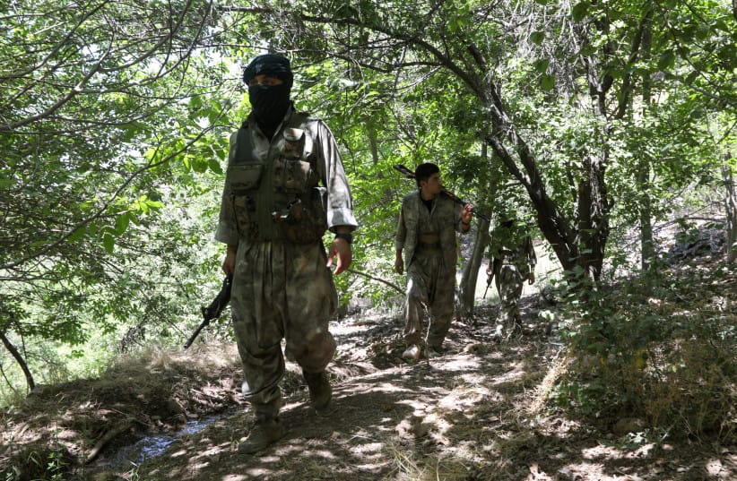 Fighters from the Kurdistan Free Life Party (PJAK), an Iranian Kurdish opposition group, are pictured near the border with Iran in Iraq's Kurdistan Region, in the outskirts of Sulaimaniya, Iraq, June 21, 2025.