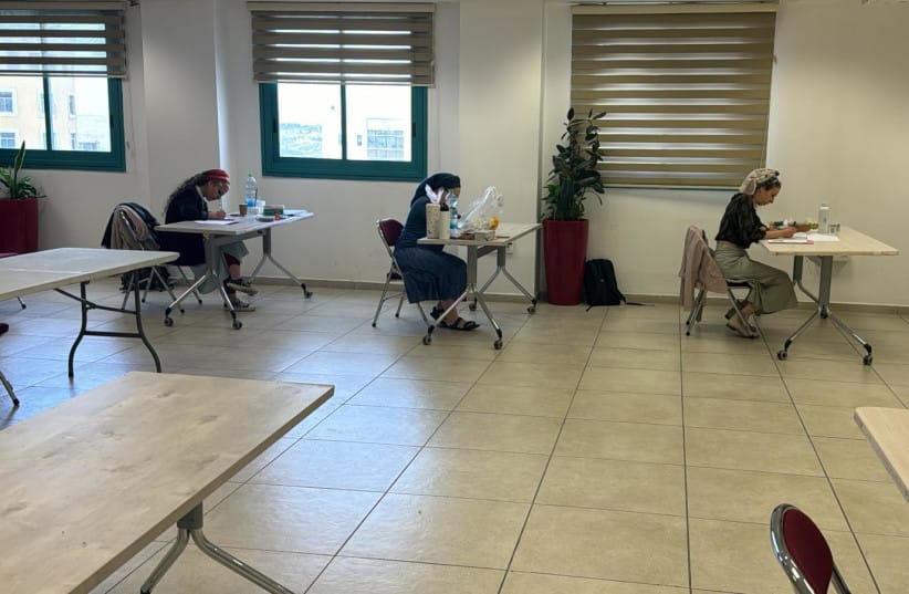 Three women who arrived in the morning to sit the Rabbinate exams finally do so at a four-hour delay, April 27, 2026 (credit: ITIM)