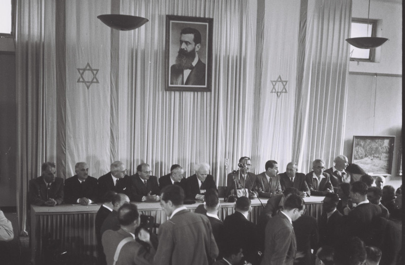 DAVID BEN-GURION announces the establishment of the State of Israel on May 14, 1948.