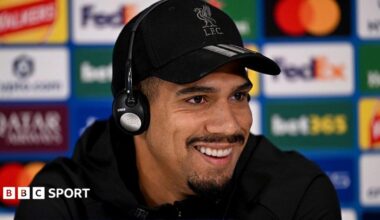 Ronald Araujo wearing headphones at a media conference