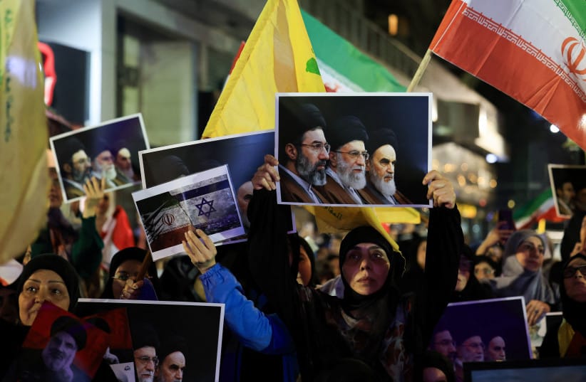Hezbollah supporters hold flags and posters during a rally in Beirut's southern suburbs, Lebanon June 10, 2026.