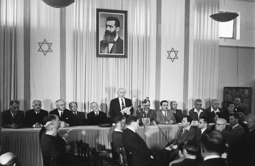 Founding father Herzl watches over David Ben-Gurion as he reads Israel’s Declaration of Independence, Tel Aviv, May 14, 1948.