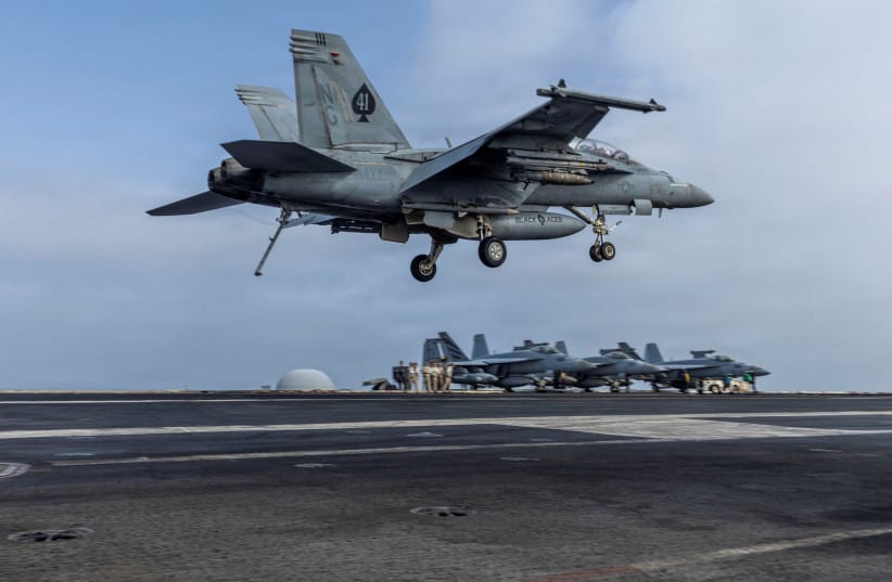 An F/A-18F Super Hornet, assigned to Strike Fighter Squadron 41, prepares to make an arrested landing on the flight deck of Nimitz-class aircraft carrier USS Abraham Lincoln during the ongoing conflict with Iran August 4, 2026.