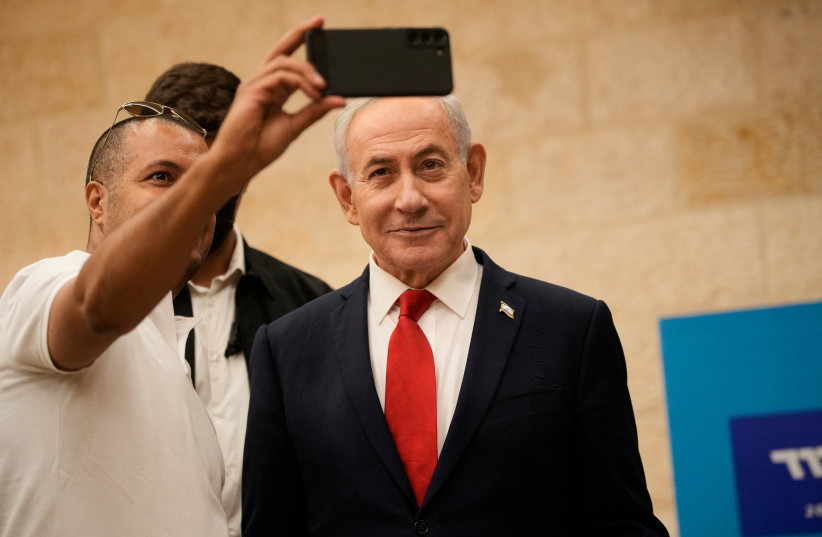 A man takes a selfie with Prime Minister Benjamin Netanyahu during Likud party primary elections ahead of Israel’s general election in October, in Jerusalem, Monday, August. 17, 2026.