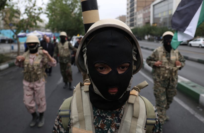 A member of Basij paramilitary forces attends a rally in support of Palestinians, in Tehran, Iran, October 13, 2023; illustrative. (credit: Majid Asgaripour/WANA