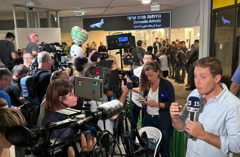 Media and loved ones await the passengers from the flydubai rescue flight for hijacked flight FZ1073 following its arrival in Israel on September 30, 2026.