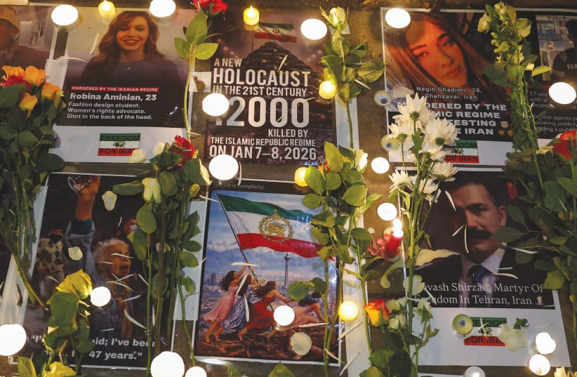 A CANDLE-LIT tribute displays photographs of protesters believed to have been killed during Iran’s January uprising, as demonstrators gather outside the Iranian embassy in London on January 18.