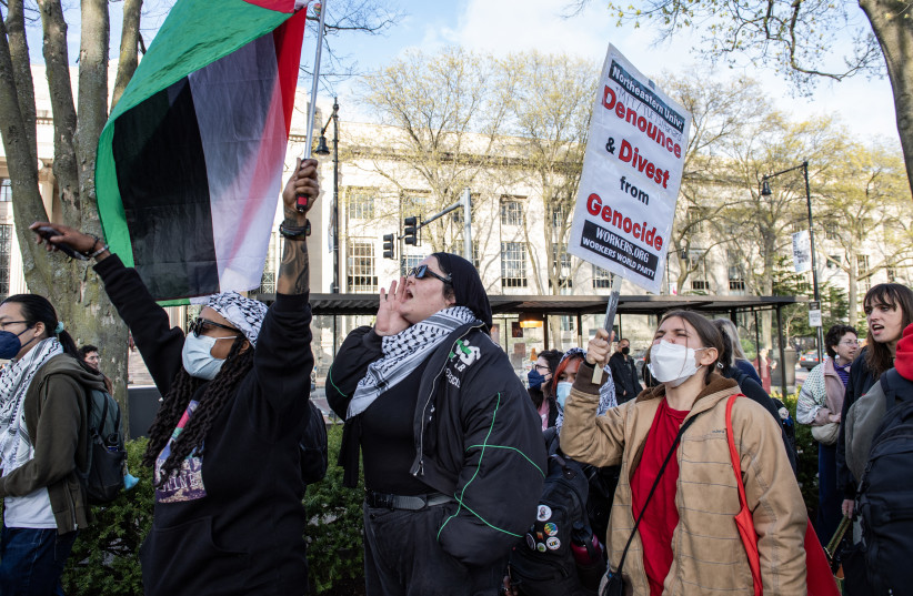 Pro-Palestinian students and activists cheer as they extend their encampment beyond its barriers and to Massachusetts Avenue in front of the Massachusetts Institute of Technology (MIT) in Cambridge, Massachusetts on May 1, 2024.