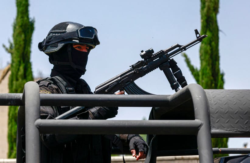 A member of the Palestinian security forces stands guard during the eighth Fatah Conference in Ramallah, in the West Bank, May 14, 2026