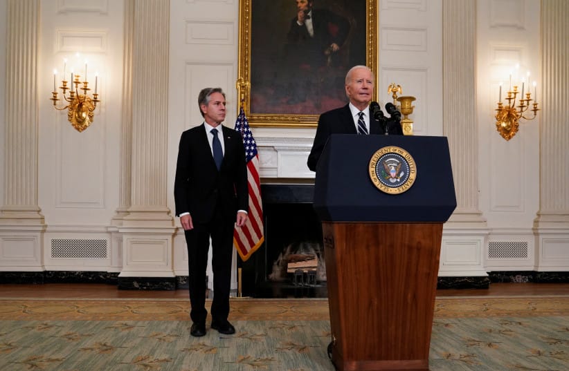 US President Joe Biden, flanked by US Secretary of State Antony Blinken, speaks about the conflict in Israel, after Hamas launched its biggest attack in decades, while making a statement about the crisis, at the White House in Washington, U.S. October 7, 2023.
