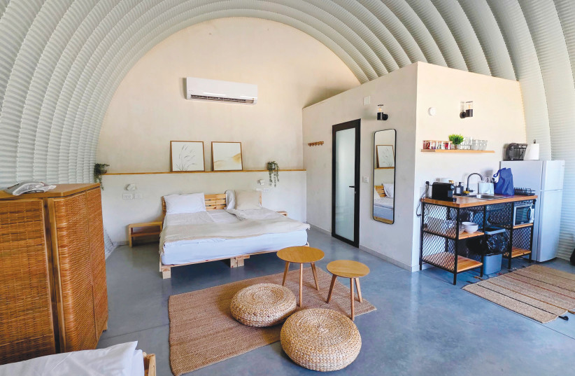 Inside A Kama suite. Under the curved ceiling, a family of up to six has soft beds, its own kitchenette and espresso machine, and no television – only a terrace and the quiet of the valley.