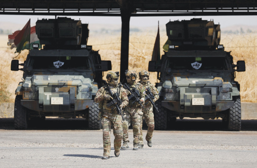Kurdish special forces patrol the outskirts of Erbil, Iraq, Sept. 22.