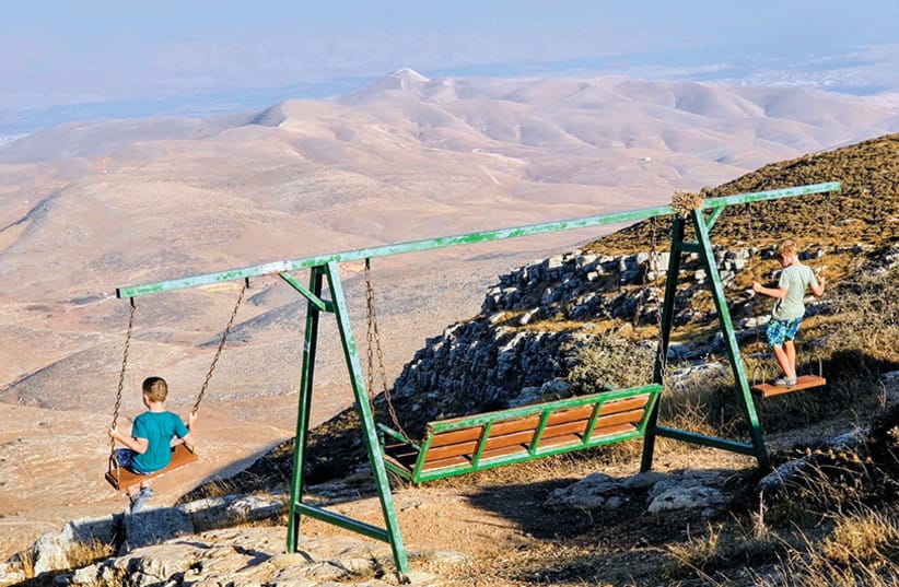 Lavie and Eitam, the writer’s sons, swing above the Samaria Desert at Mitzpe Matan, looking out toward the horn of Sartaba and the Nahal Tirza valley, where the Israelites came up into the land under Joshua.