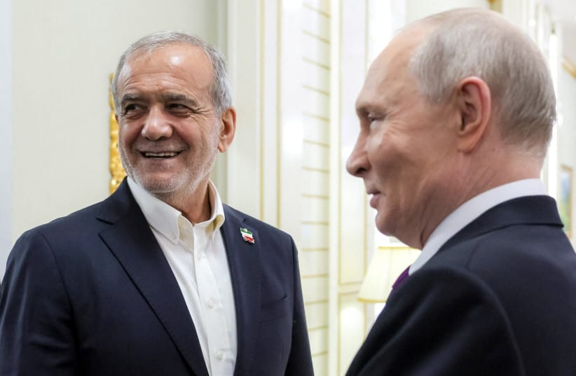 Russian President Vladimir Putin speaks with Iranian President Masoud Pezeshkian during a meeting in Turkmenbashi, Turkmenistan, October 8, 2026; illustrative.