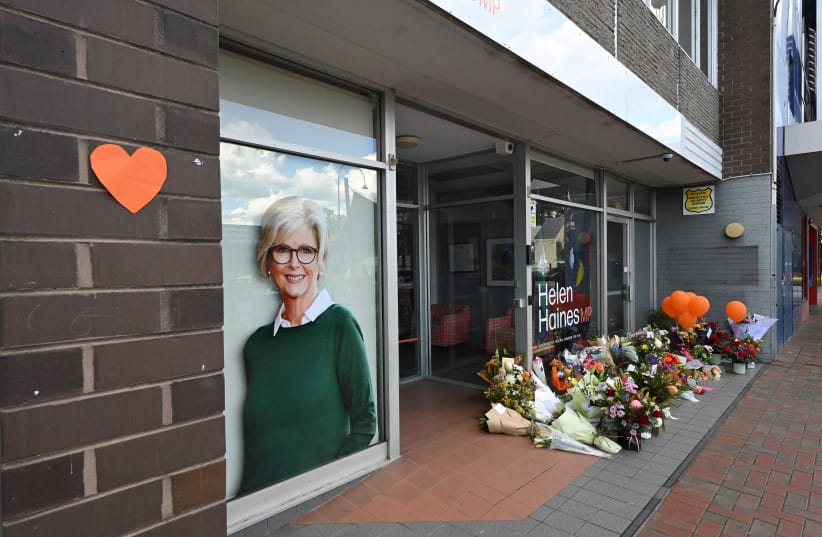 Tributes and flowers outside the electoral office of independent Australian lawmaker Helen Haines, who was deliberately struck by a car outside her office on Monday, in Wangaratta, Australia, October 20, 2026.