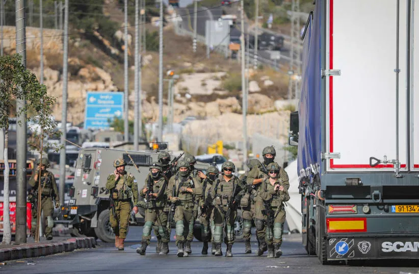 Israeli security forces near the scene of a shooting attack near the West Bank city of Hebron, October 23, 2026. Five people were wounded in the attack, two of them seriously, and two Palestinian terrorists were killed by Israeli forces.