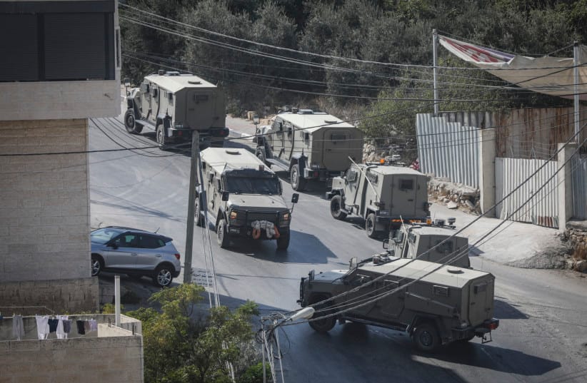 Israeli soldiers take part in a military operation in the West Bank city of Hebron following a shooting attack in the area earlier in the day, October 23, 2026.
