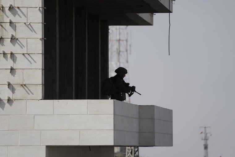 Israeli soldiers take up positions during an army operation in the West Bank city of Hebron Saturday, Oct. 24, 2026. A day after a Palestinian shooting attack in the area.